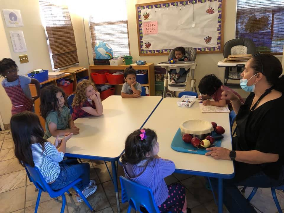 Group learning session around the activity table